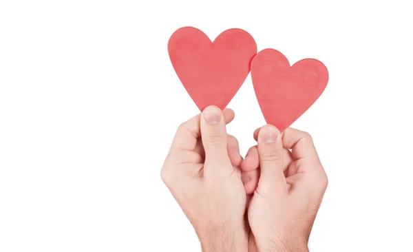 Mano sosteniendo madera corazón —  Fotos de Stock