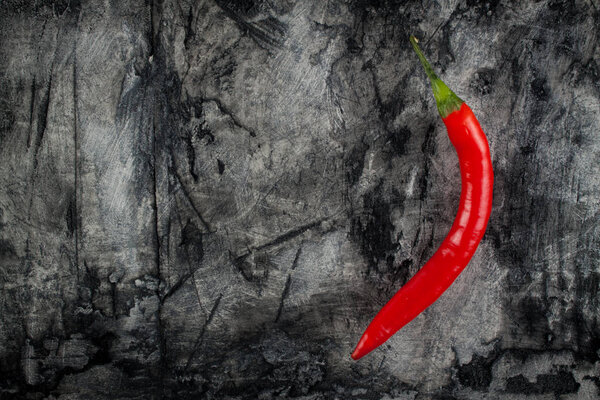 Fresh chili on grunge scratched background. 