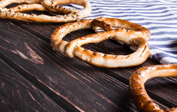 Fresh pretzel on the boards. — Stock Photo, Image