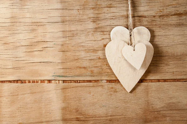 Wood hearts on wood background