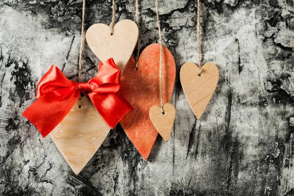 Wood hearts on wall background