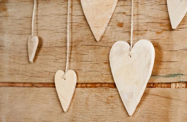 Wood hearts on wood background