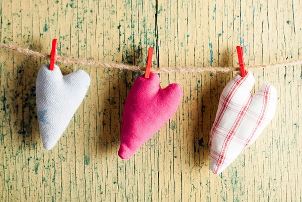 Heart made of cloth on wood desk — Stock Photo, Image