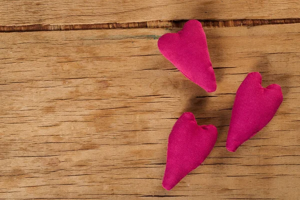 Heart made of cloth on wood desk — Stock Photo, Image