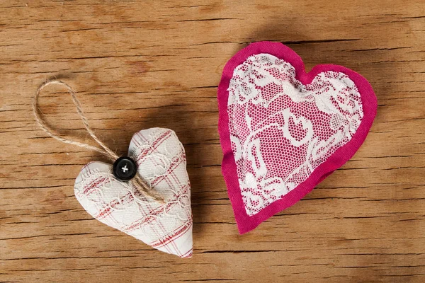 Heart made of cloth on wood desk — Stock Photo, Image