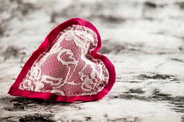 Heart made of cloth on wood desk — Stock Photo, Image