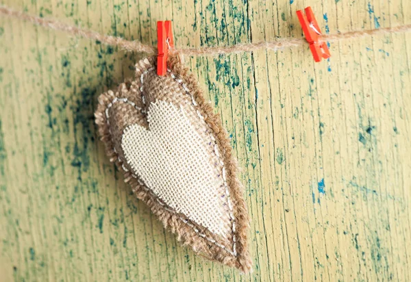 Heart from cloth on wood desk — Stock Photo, Image