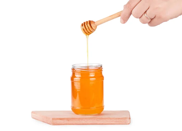Tarro de vidrio con miel — Foto de Stock