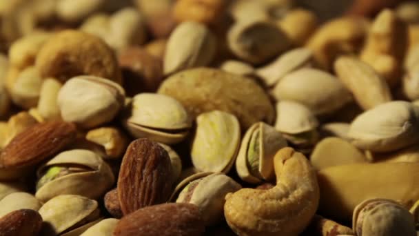 Nuts background with a mixed assortment of seeds — Stock Video