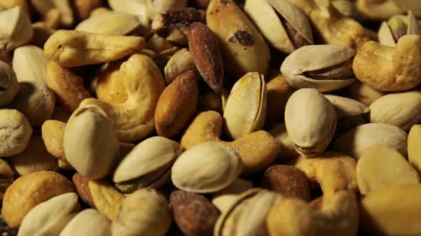 Nuts background with a mixed assortment of seeds — Stock Video