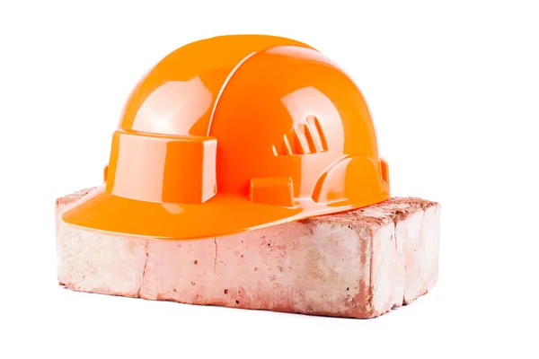 Beyaz arka plan üzerinde izole oyuncak turuncu yapı kask — Stok fotoğraf