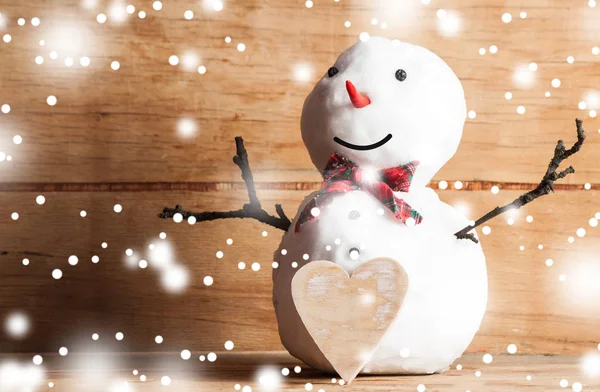 Small snowman on wood desk — Stock Photo, Image