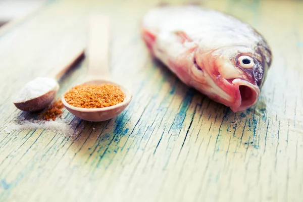 Raw fish on wood — Stock Photo, Image