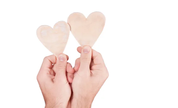 Dřevěné srdce v ruce — Stock fotografie