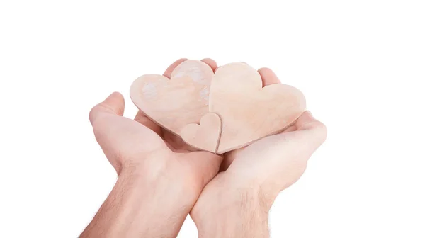 Corazón de madera en la mano —  Fotos de Stock
