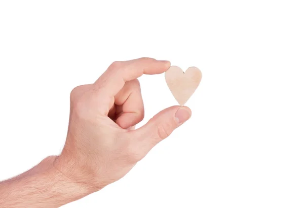 Coração de madeira na mão — Fotografia de Stock