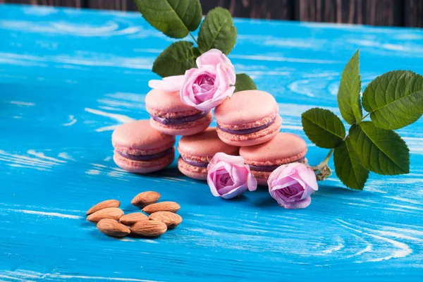 Colored macaroons on wood desk — Stock Photo, Image