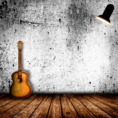 Boş odada eski gitar
