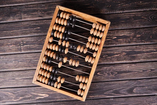 Abacus vintage sobre fondo de madera — Foto de Stock