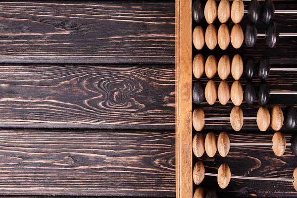 Abacus vintage sobre fondo de madera — Foto de Stock