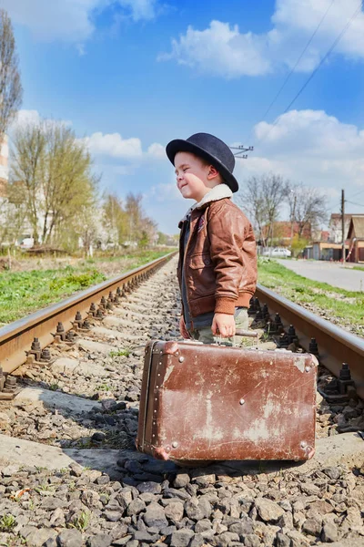 Little boy with suit case