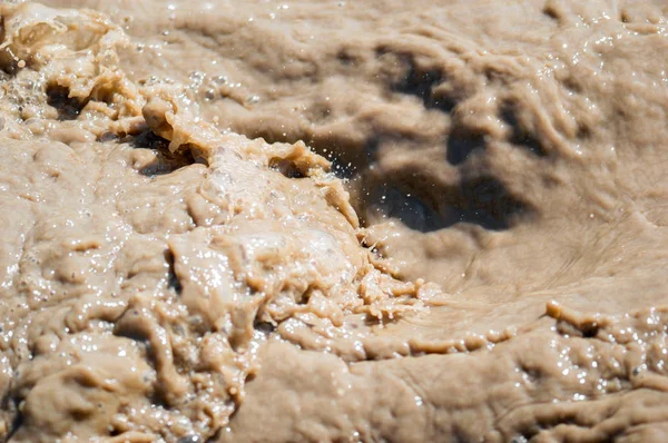 Streams and splashes of dirty water close-up background image