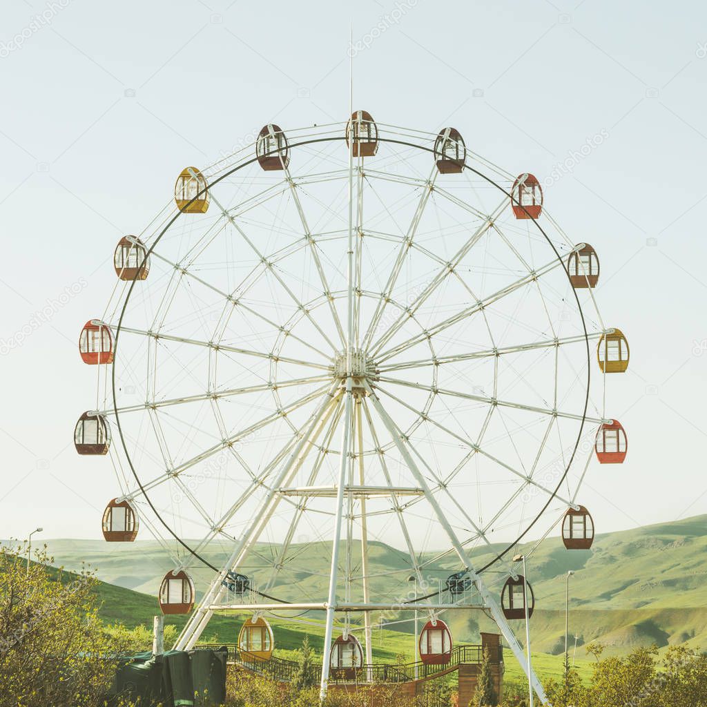 Ferris wheel with view on the mountains