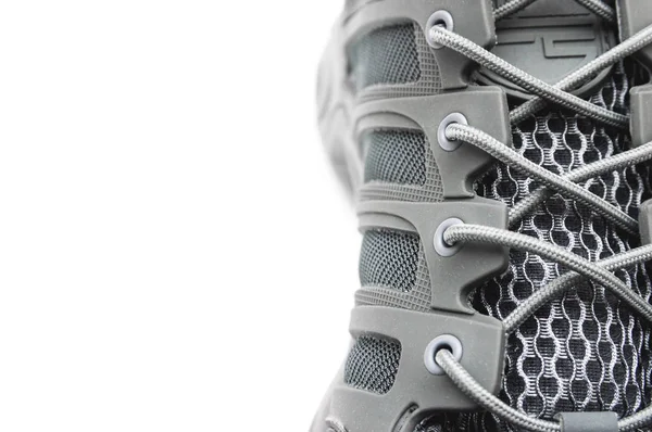 Zapatillas de senderismo gris aisladas sobre fondo blanco —  Fotos de Stock