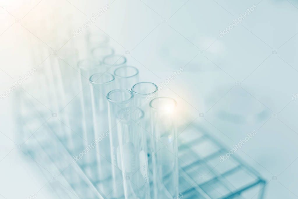 scientist hand holding laboratory test tube, science laboratory 