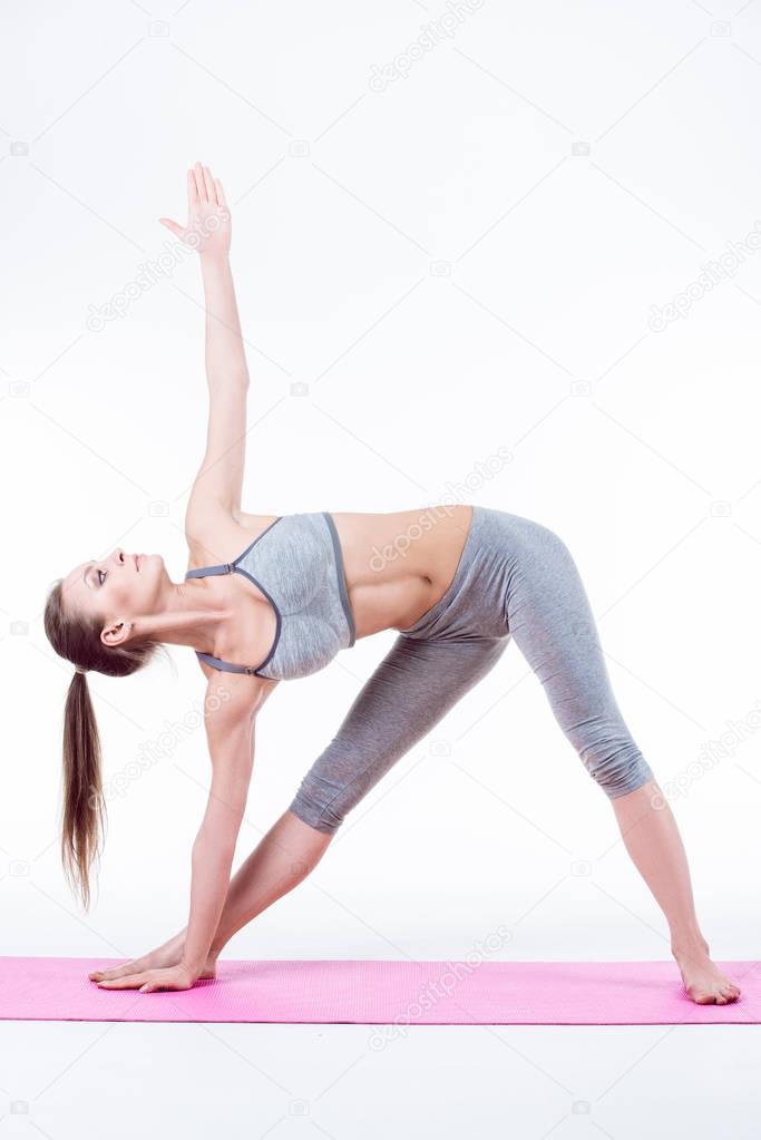 young woman does yoga