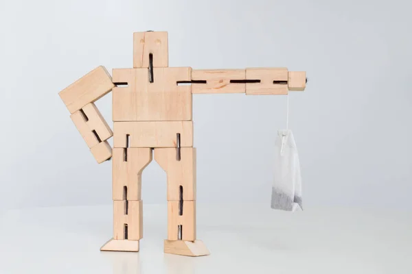 Wooden Robot Toy Hold Tea Bag — Stock Photo, Image