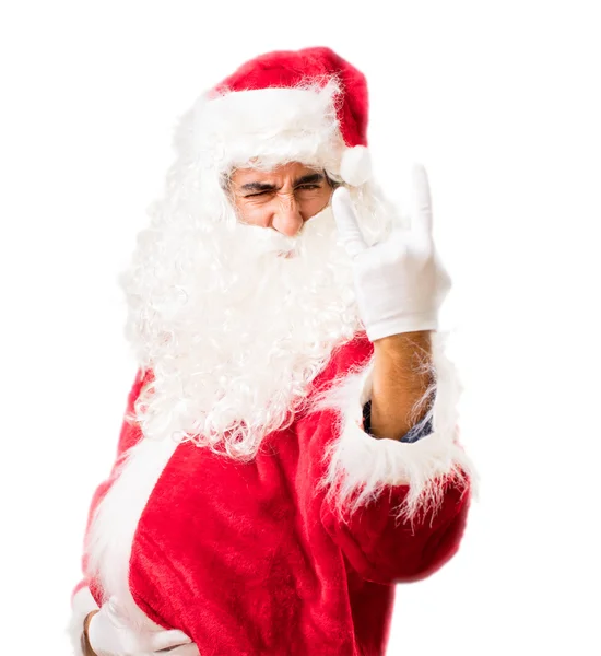 Santa claus in oneens pose — Stockfoto