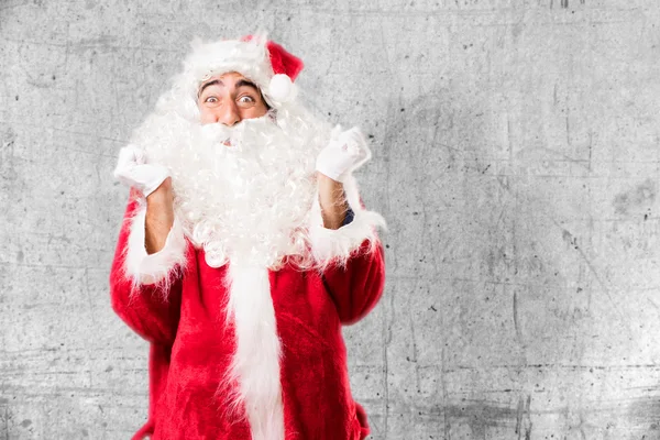 Santa claus in oneens pose — Stockfoto