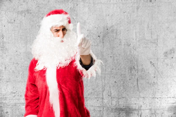 Santa claus in oneens pose — Stockfoto