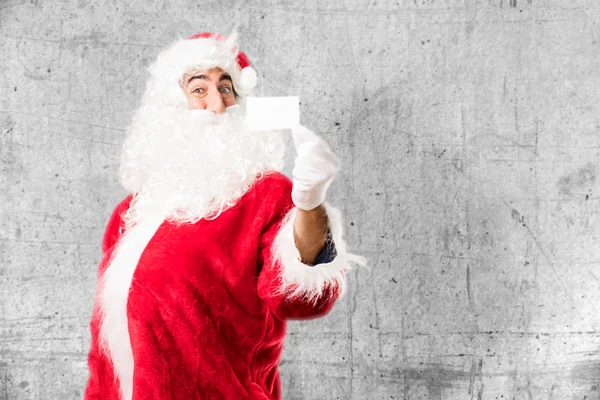 Санта-Клаус с именной картой — стоковое фото