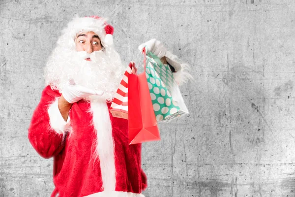 Kerstman met shopping tassen — Stockfoto