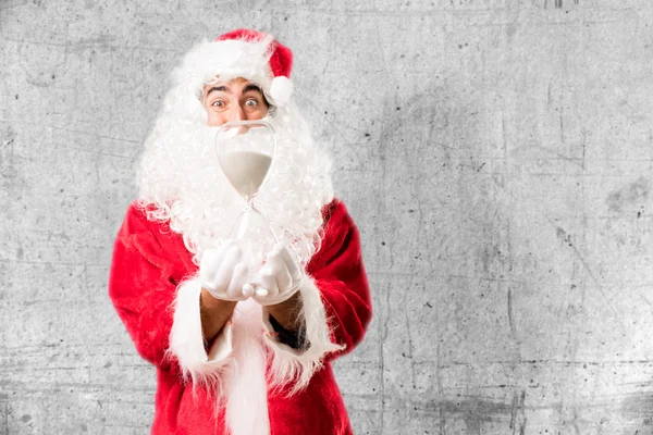 Santa claus s písečné hodiny — Stock fotografie