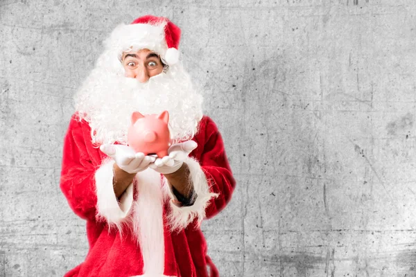 Santa claus with saving bank — Stock Photo, Image