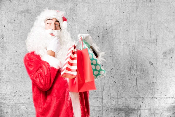 Kerstman met shopping tassen — Stockfoto