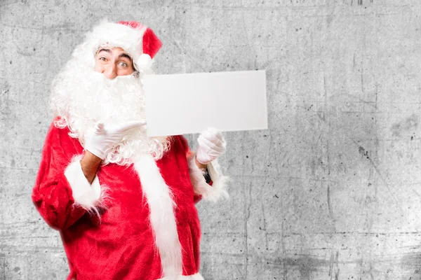 Kerstman met bordje — Stockfoto