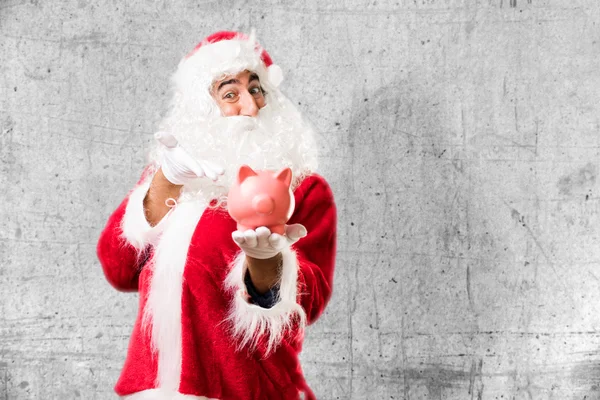Santa Claus con caja de ahorros —  Fotos de Stock