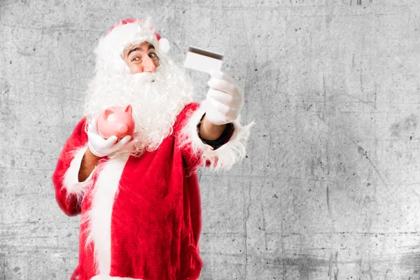 Санта-Клаус со сберегательным банком — стоковое фото