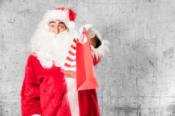 Kerstman met shopping tassen — Stockfoto