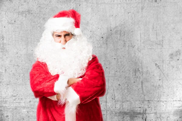 Santa claus in oneens pose — Stockfoto