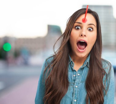 surprised young woman with arrow