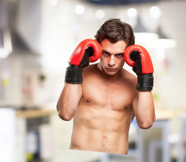 Strong young man boxing — Stock Photo, Image