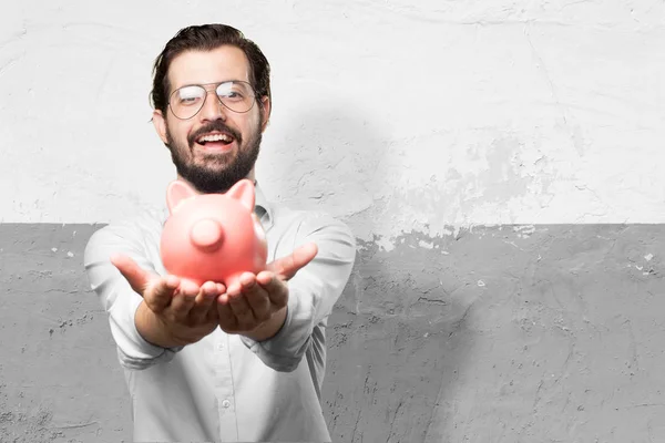 Happy young man piggy bank — Stock Photo, Image