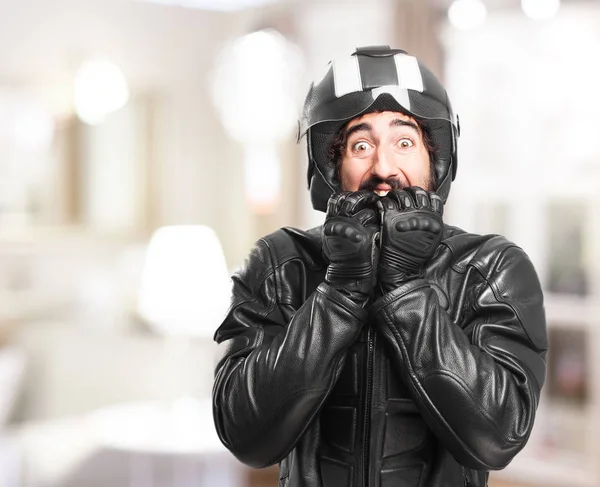 Ciclista asustado con casco de motocicleta —  Fotos de Stock