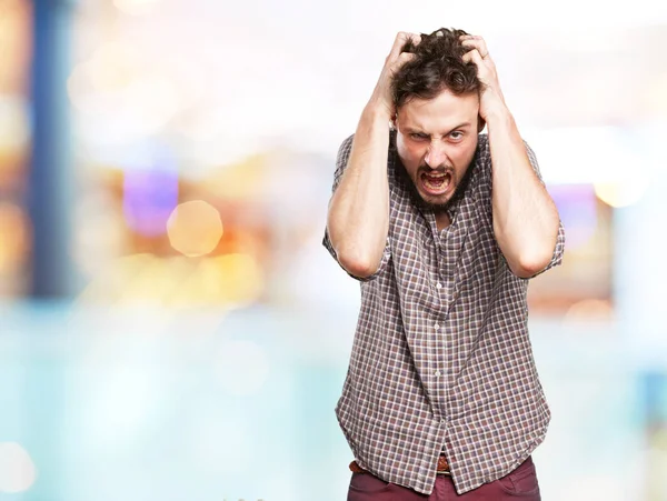 Angry young man shouting — Stock Photo, Image