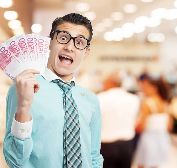 Happy businessman with bills — Stock Photo, Image